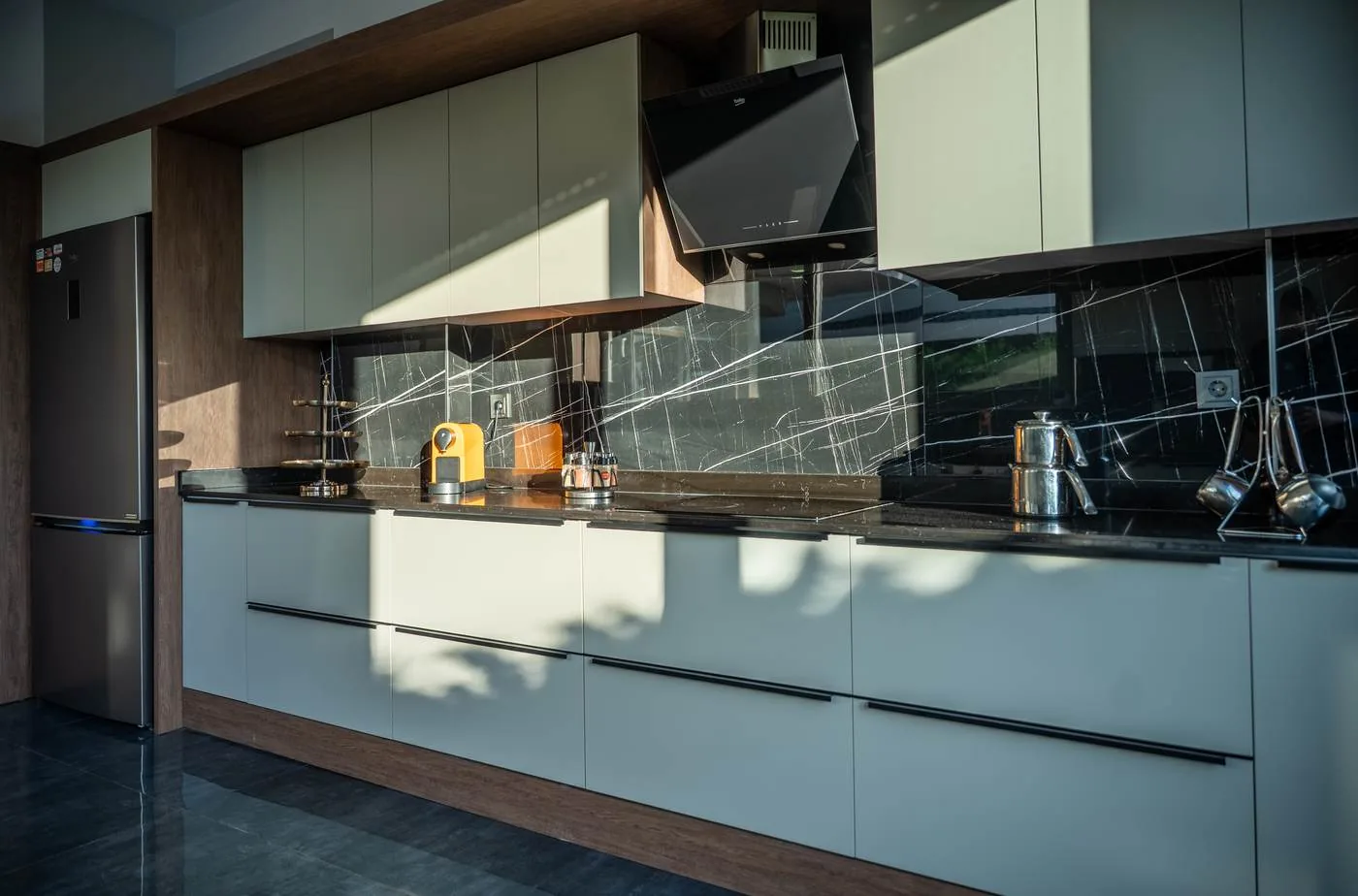 Black marble splashback and coffee machine detail