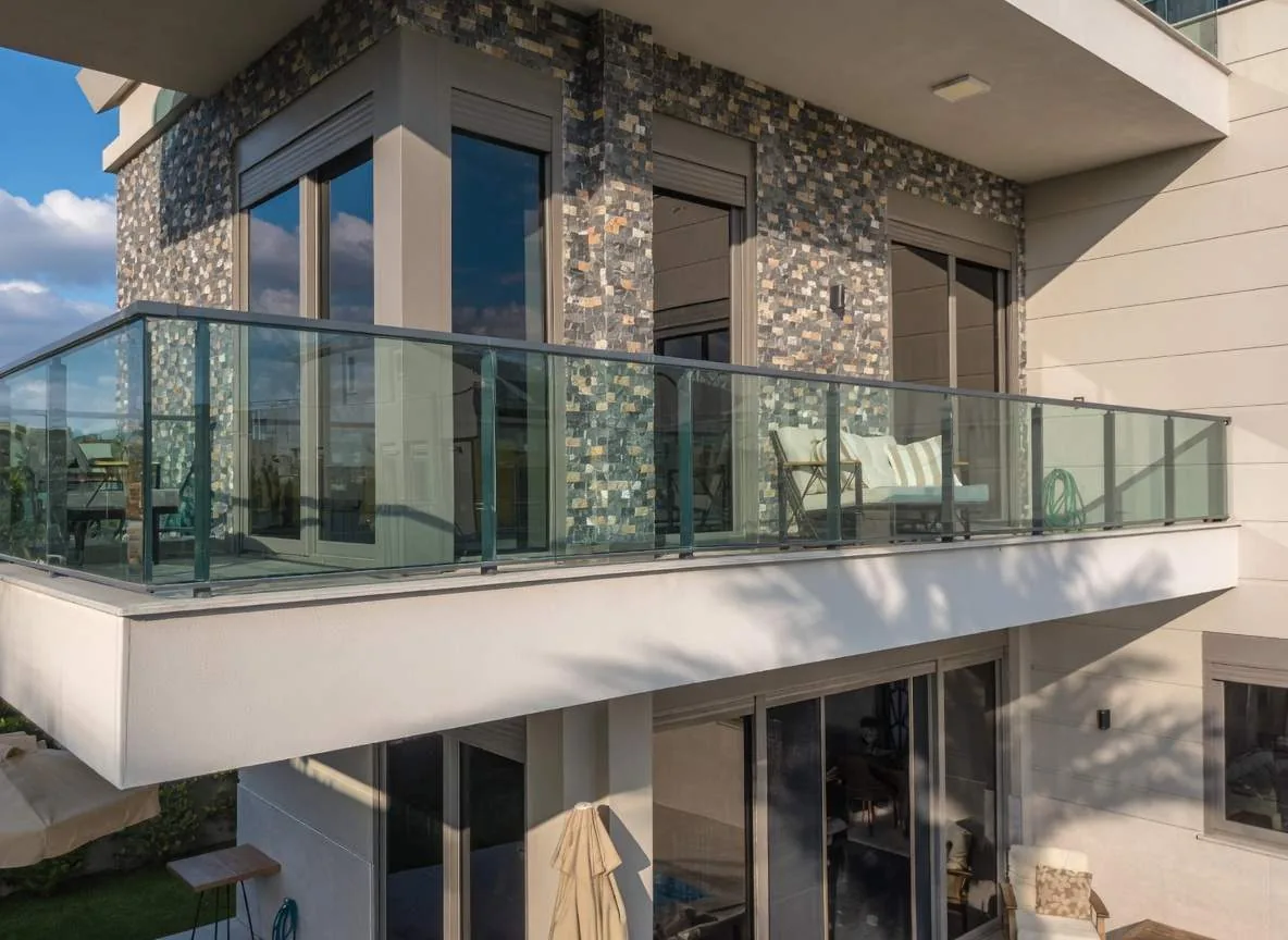 Glass balcony of the villa with external blackout roller shutters