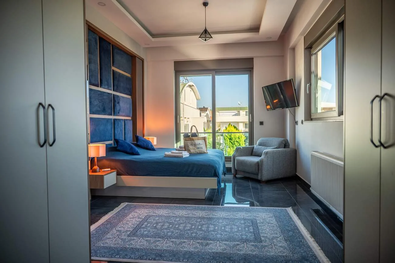 Room Blue with velvet headboard and balcony